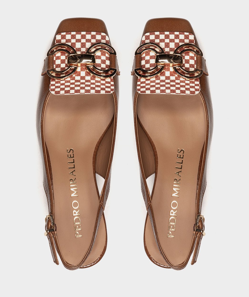 <p>High-heeled brown patent leather shoes, with an open back.</p> PEDRO MIRALLES Brown