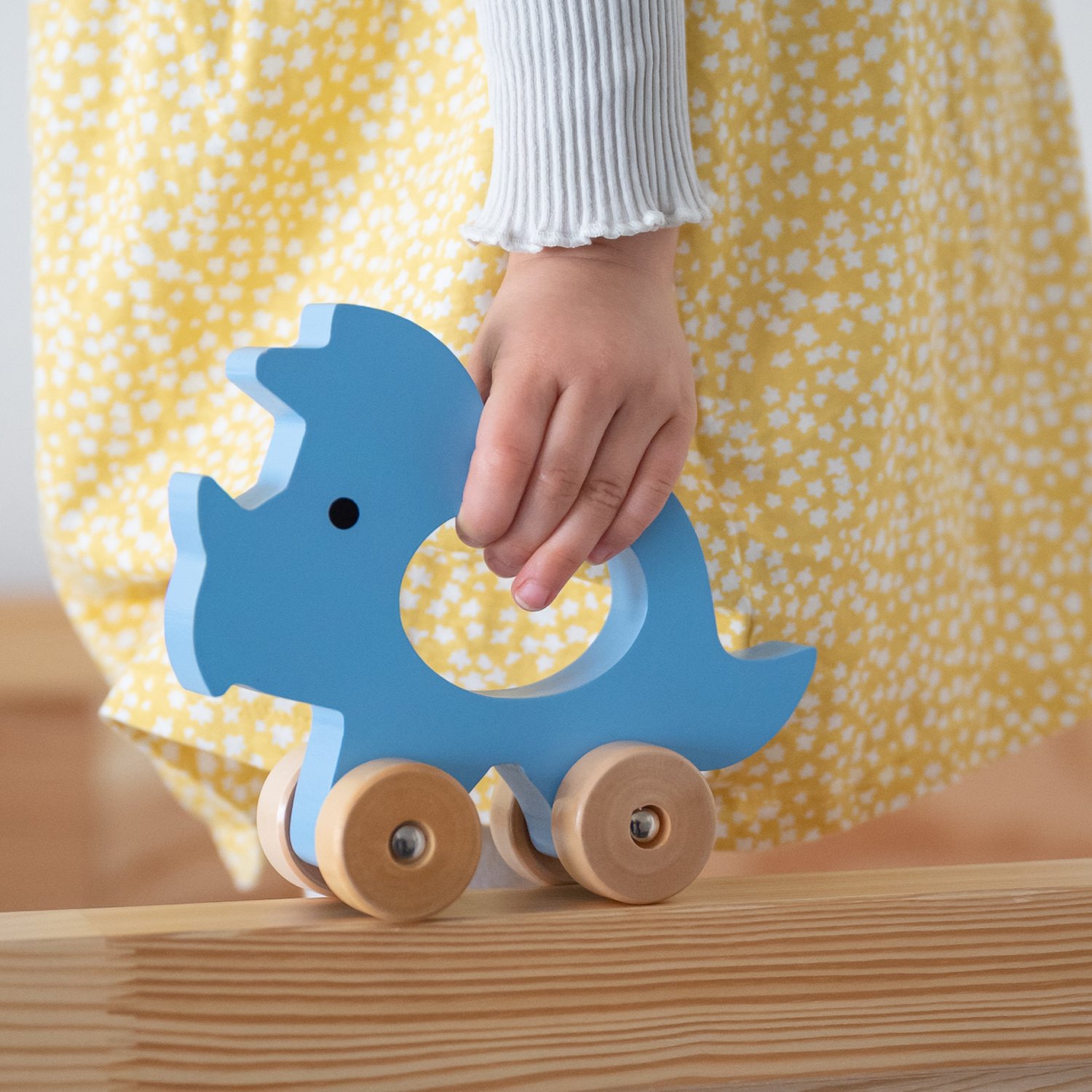 Push-along triceratops KINDSGUT Blue