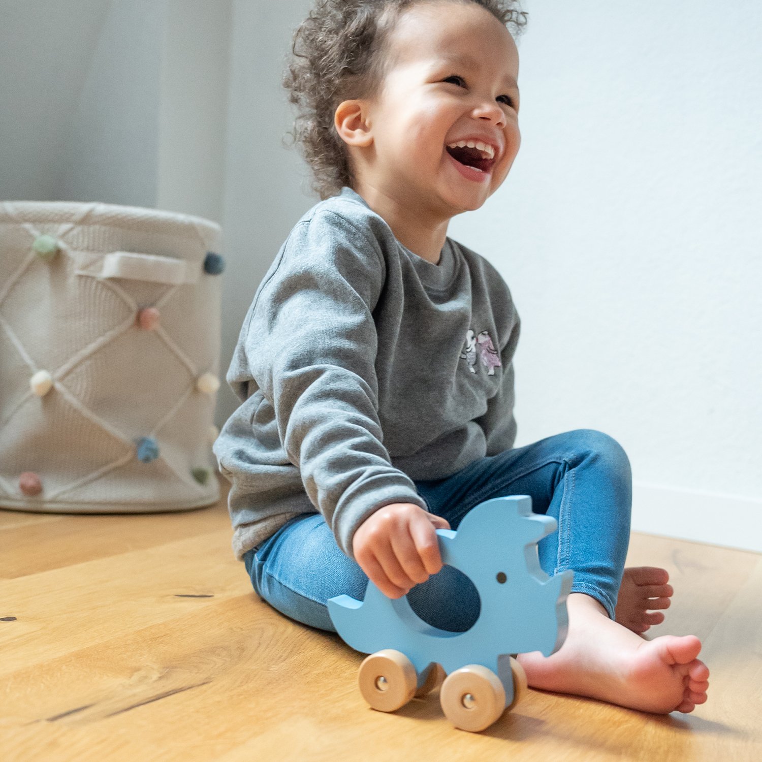 Push-along triceratops KINDSGUT Blue