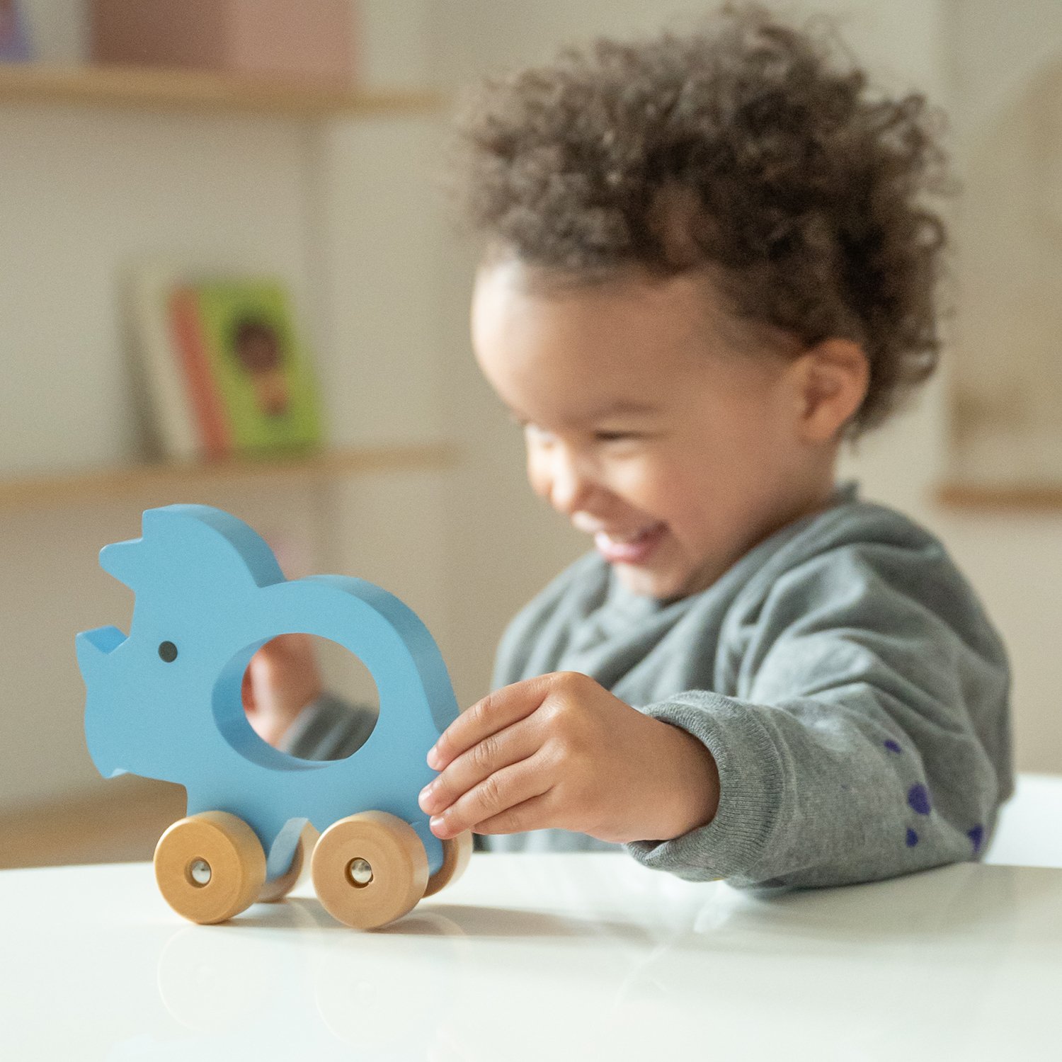 Push-along triceratops KINDSGUT Blue