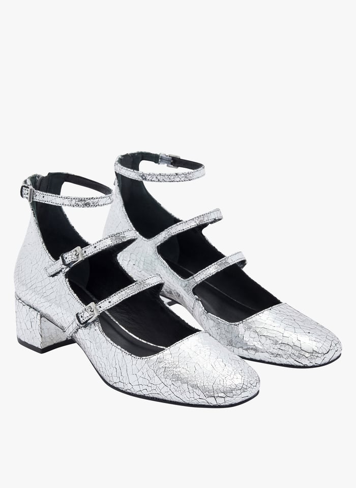 Zapatos tipo babies de piel metalizada en plata