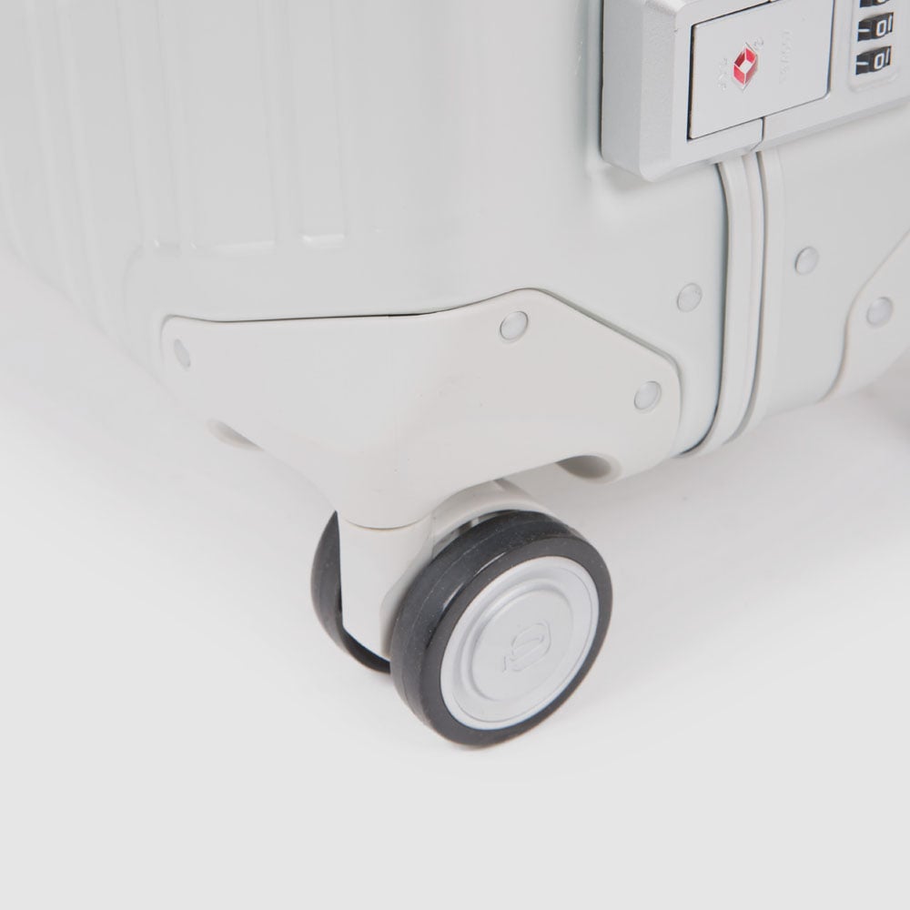 Medium 4-wheel trolley suitcase in aluminum and leather with TSA lock PIQUADRO Grey