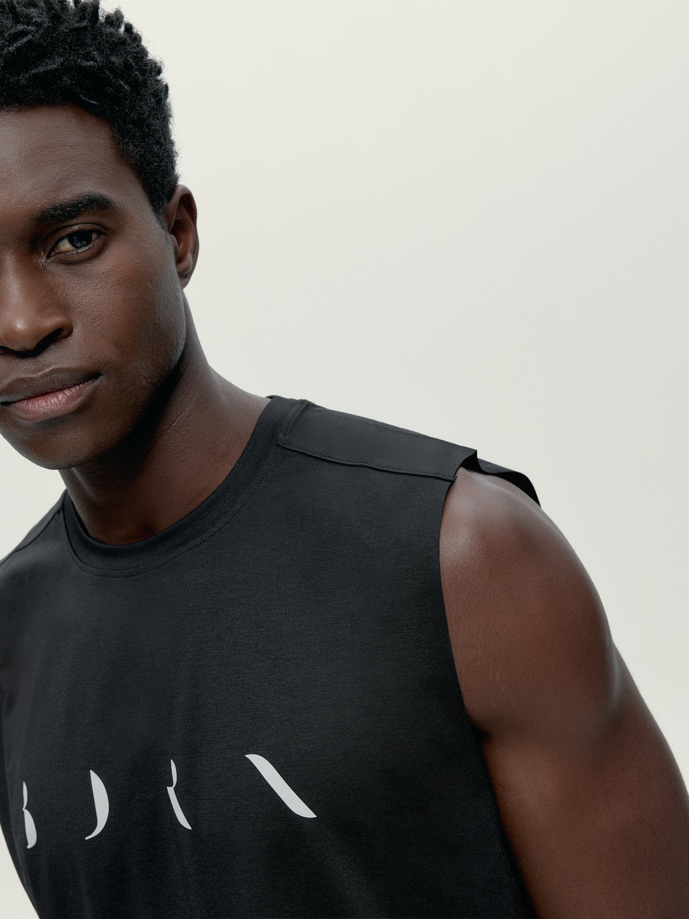 Men's sleeveless sports t-shirt by Daxon. BORN Black