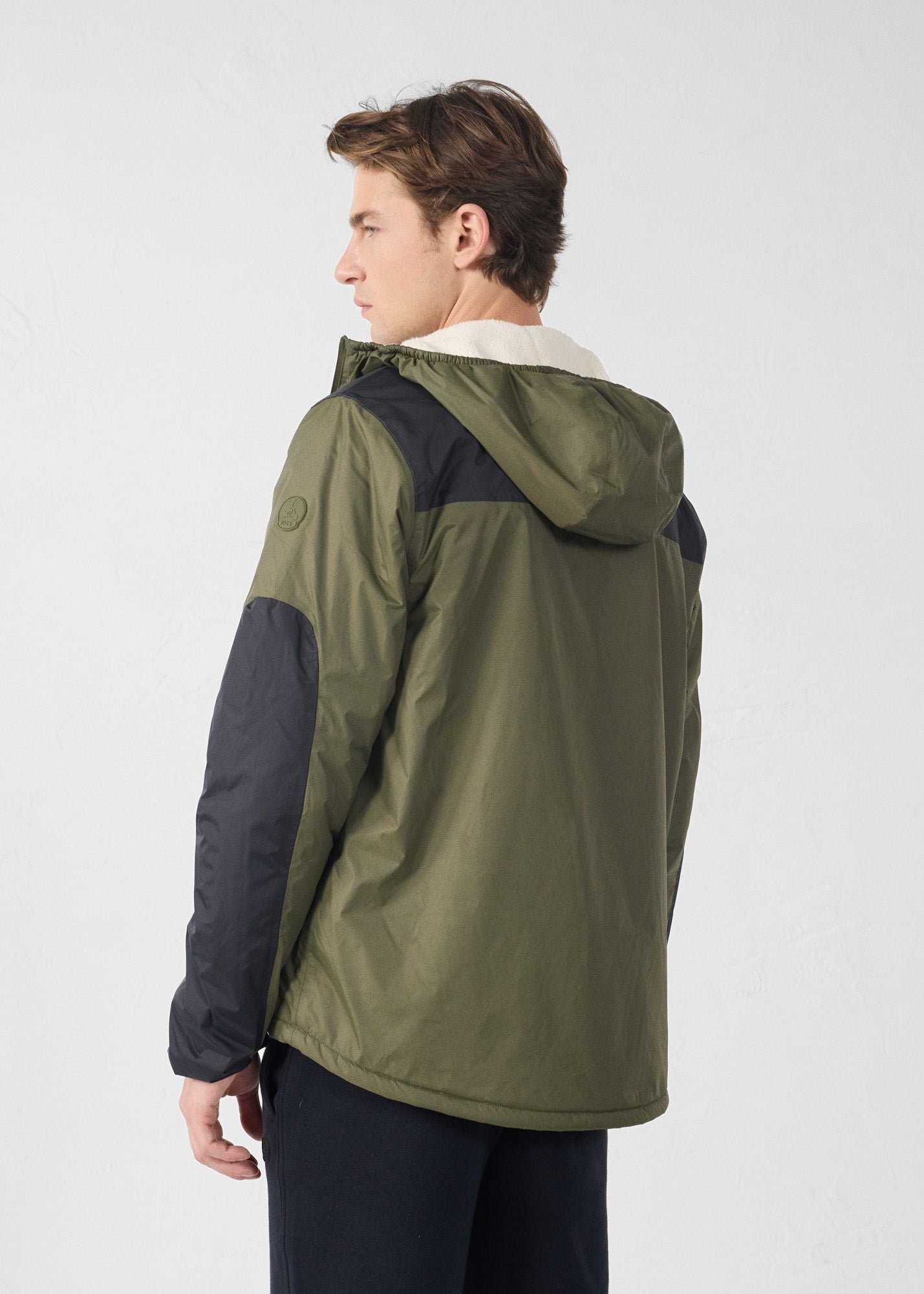Sherpa-lined waterproof coat. JOTT Green