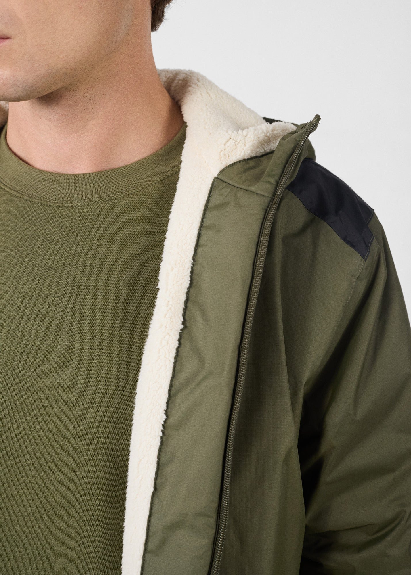 Sherpa-lined waterproof coat. JOTT Green