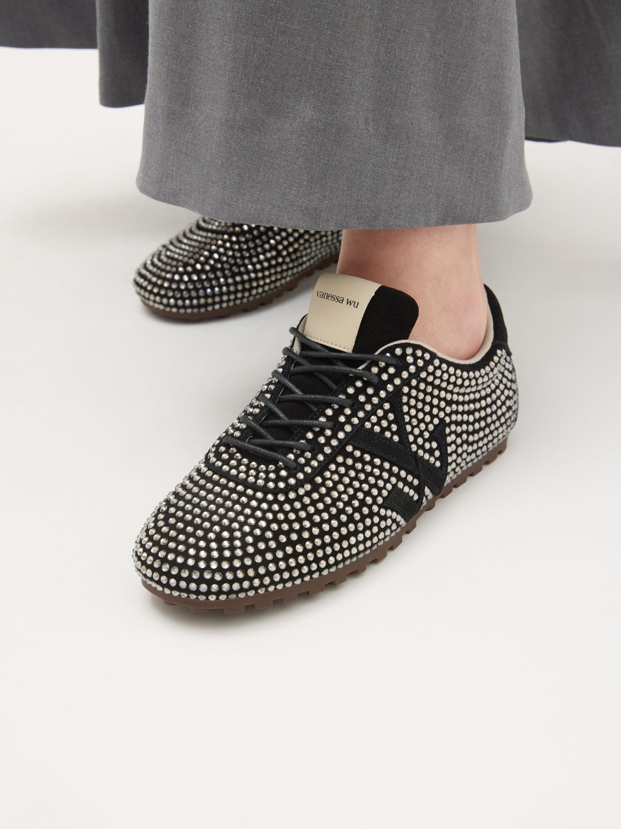Monogram-embellished sneakers adorned with rhinestones on a serrated thin sole. VANESSA WU Black