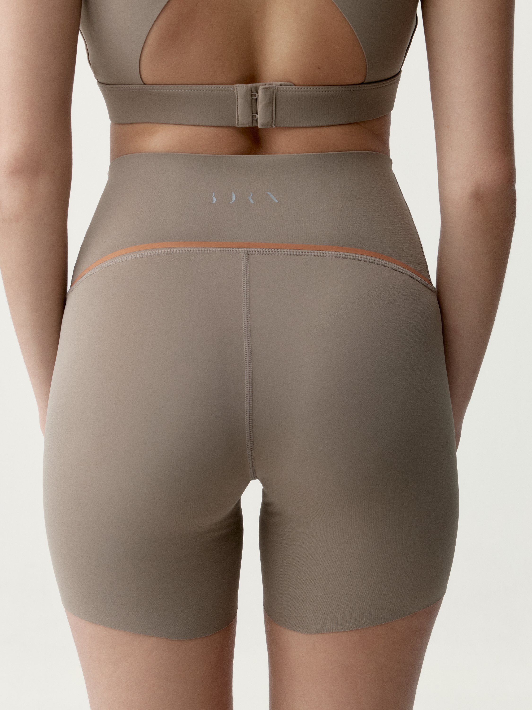 Performance sports short tight fitting black BORN Brown