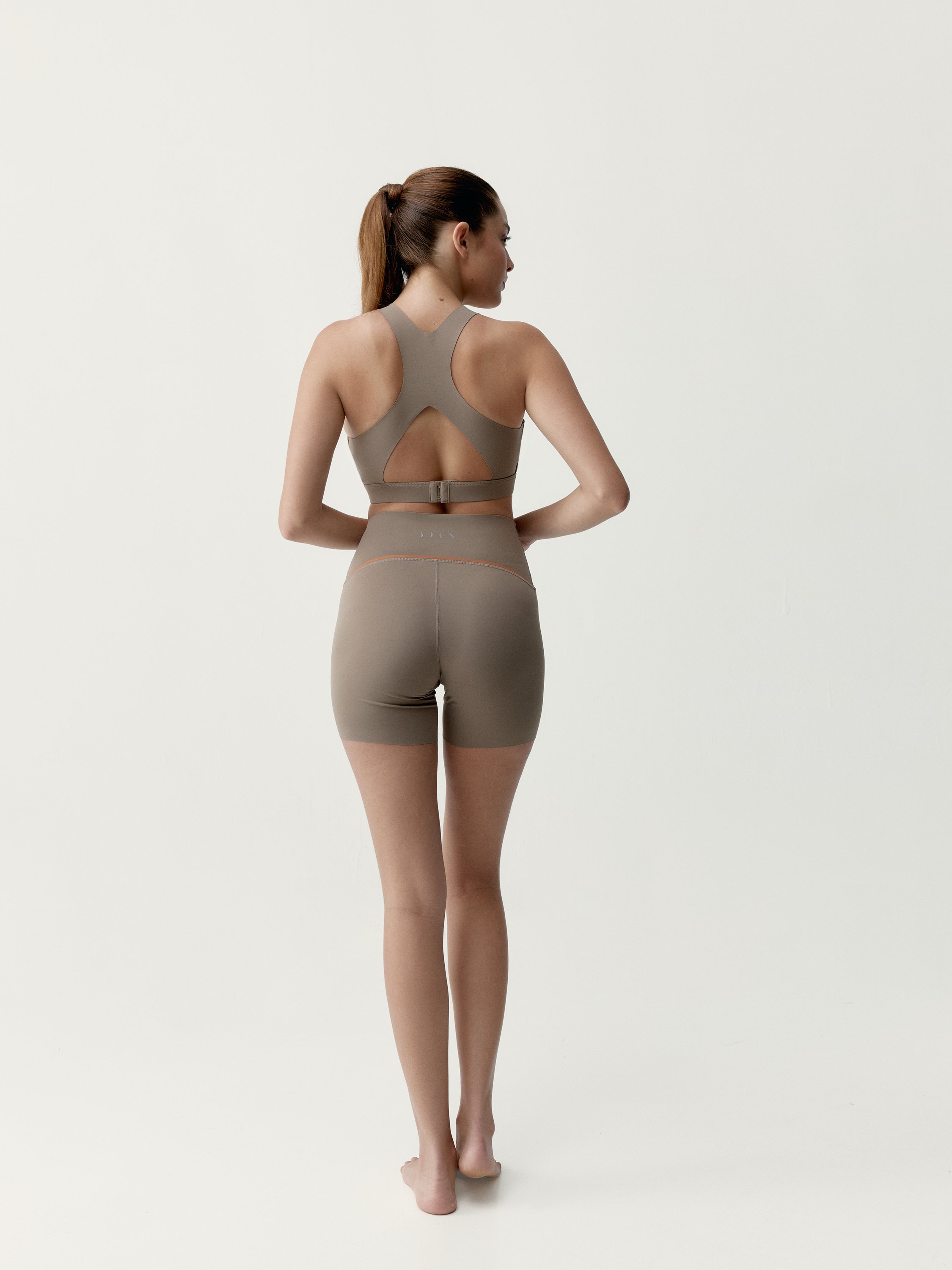 Performance sports short tight fitting black BORN Brown
