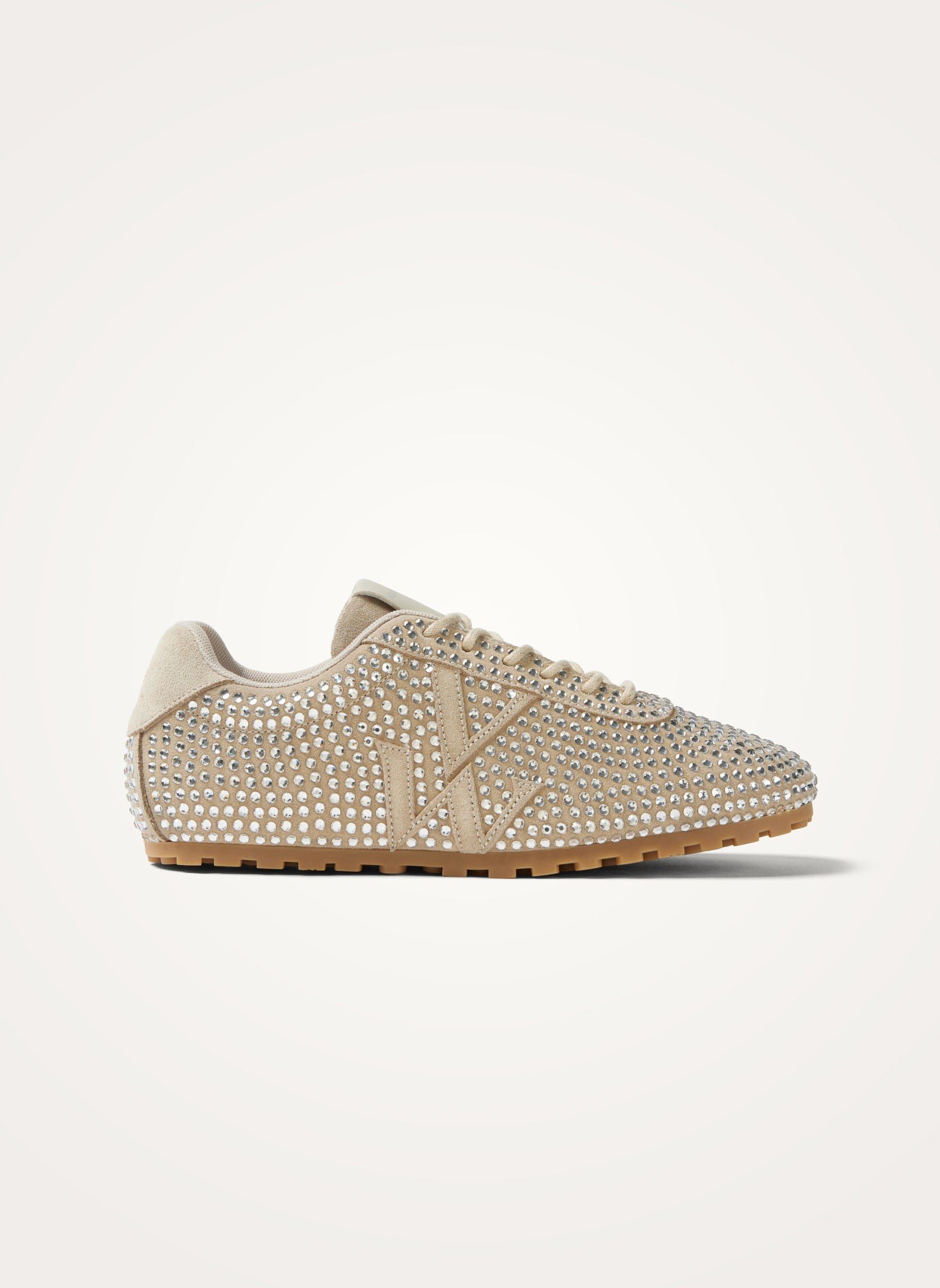 Monogram-embellished sneakers adorned with rhinestones on a serrated thin sole. VANESSA WU