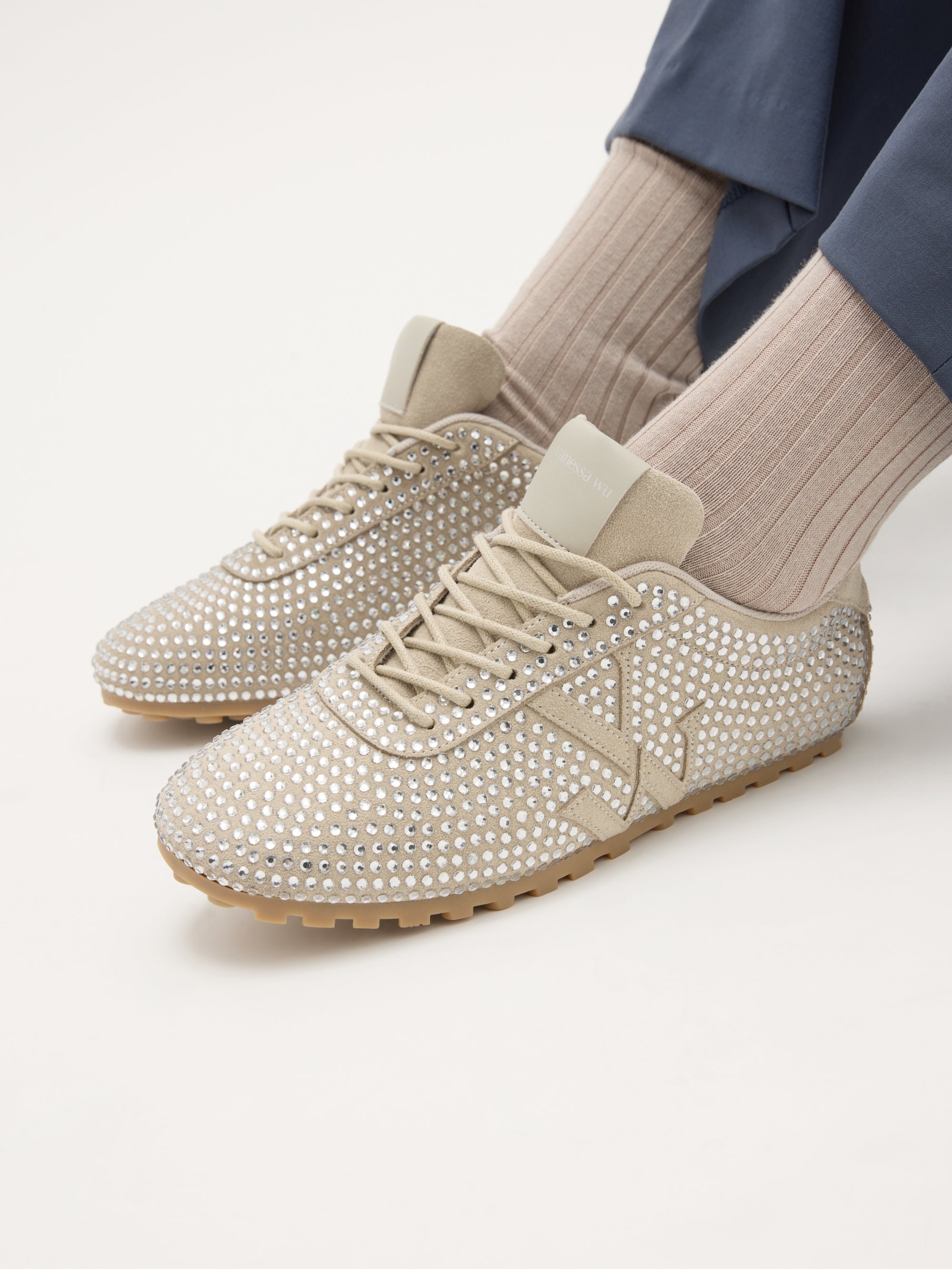 Monogram-embellished sneakers adorned with rhinestones on a serrated thin sole. VANESSA WU Beige