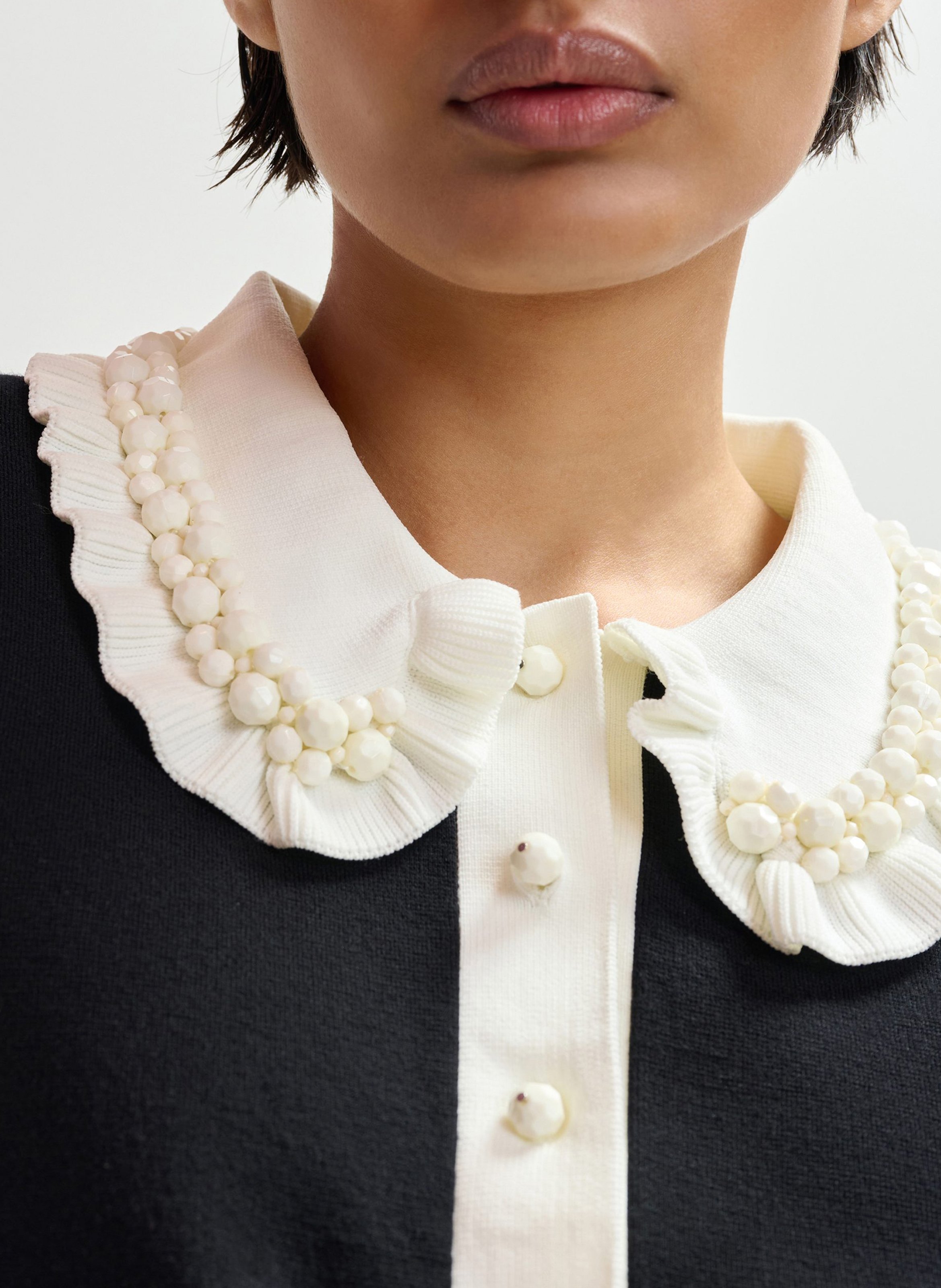 Short-sleeved plain polo with ruffles ESSENTIEL ANTWERP Black