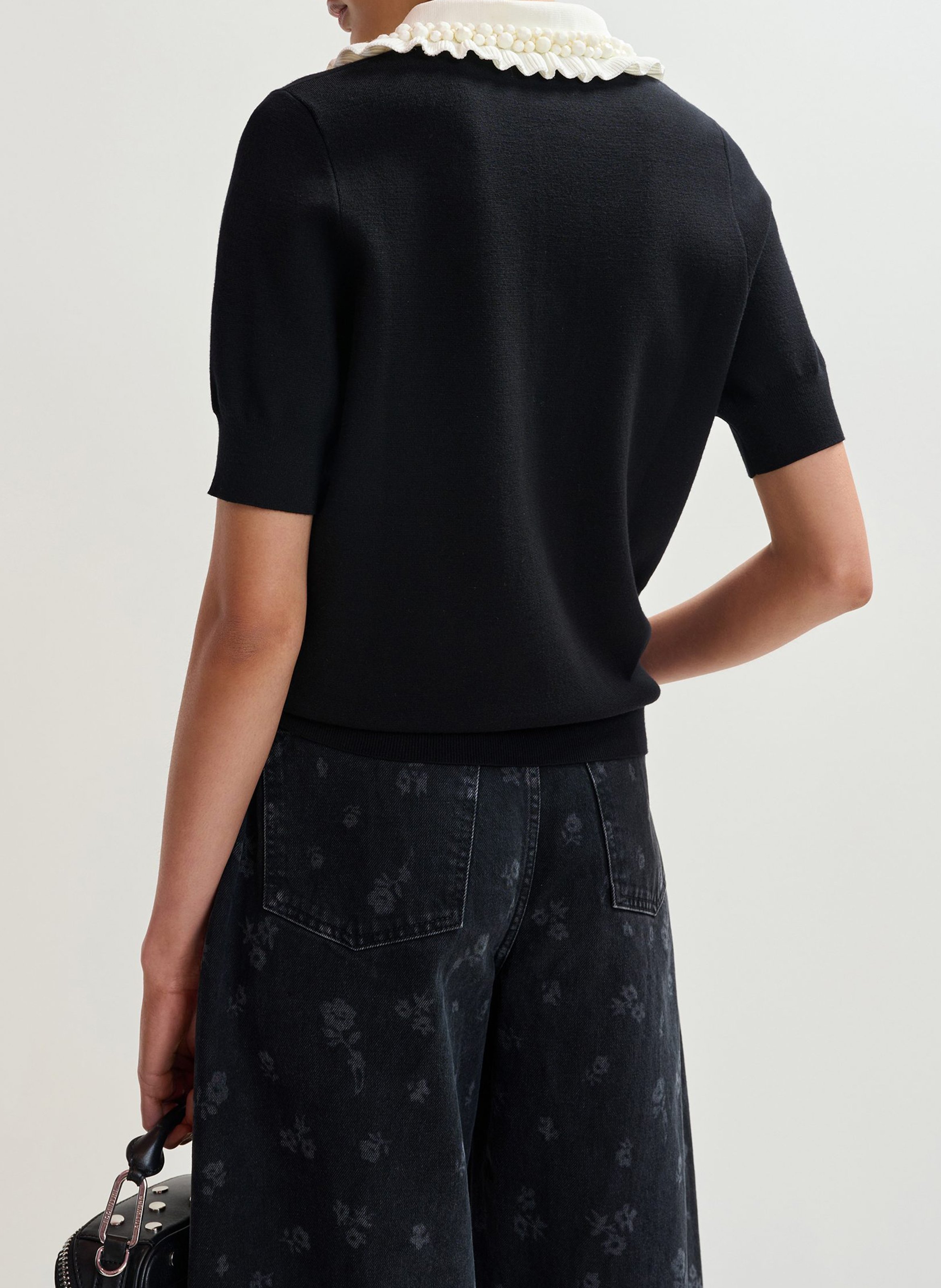 Short-sleeved plain polo with ruffles ESSENTIEL ANTWERP Black
