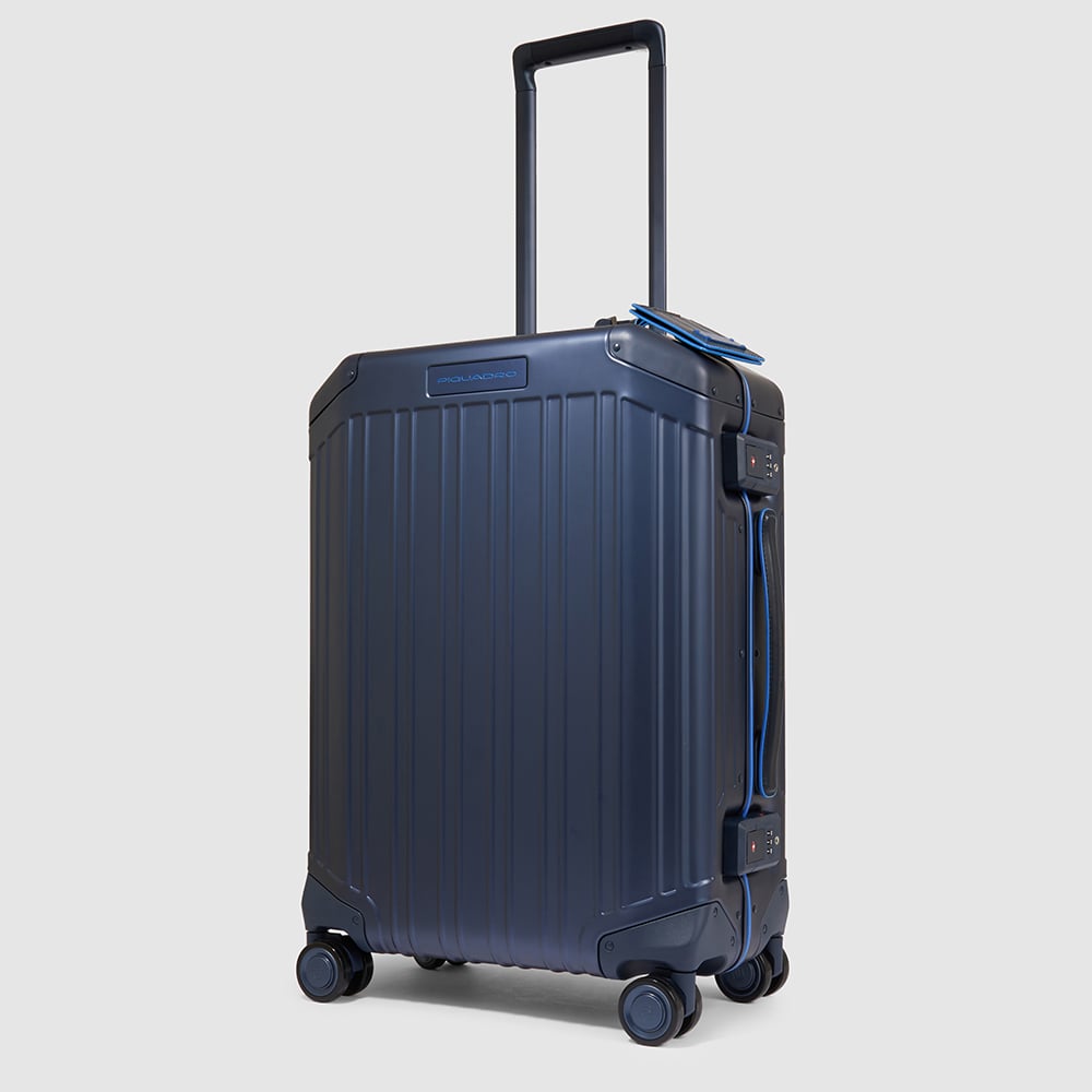 Cabin trolley suitcase with 4 wheels in aluminum and leather with TSA lock and connequ. PIQUADRO Blue