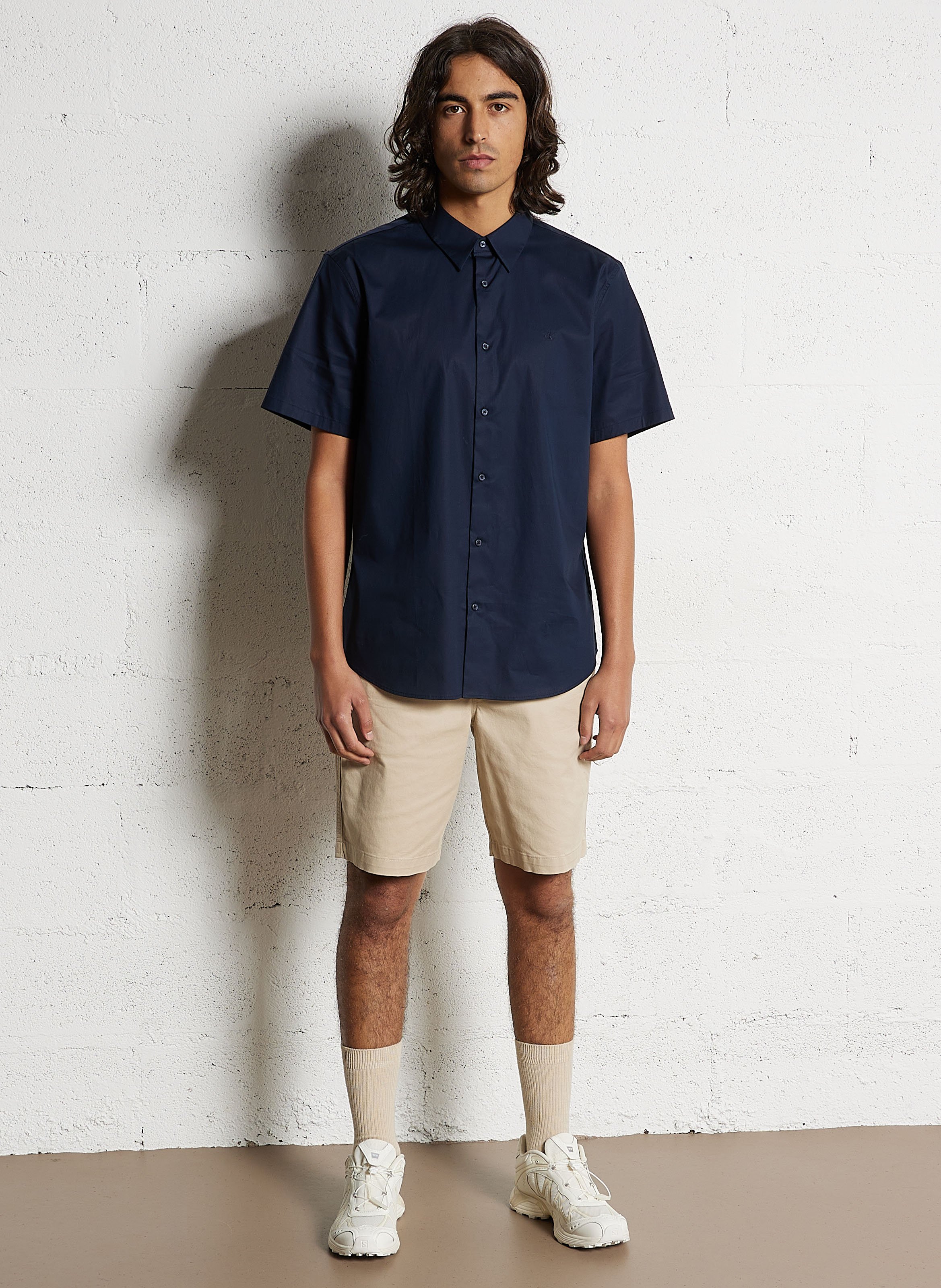 Short solid color chino in blended cotton. CALVIN KLEIN Beige