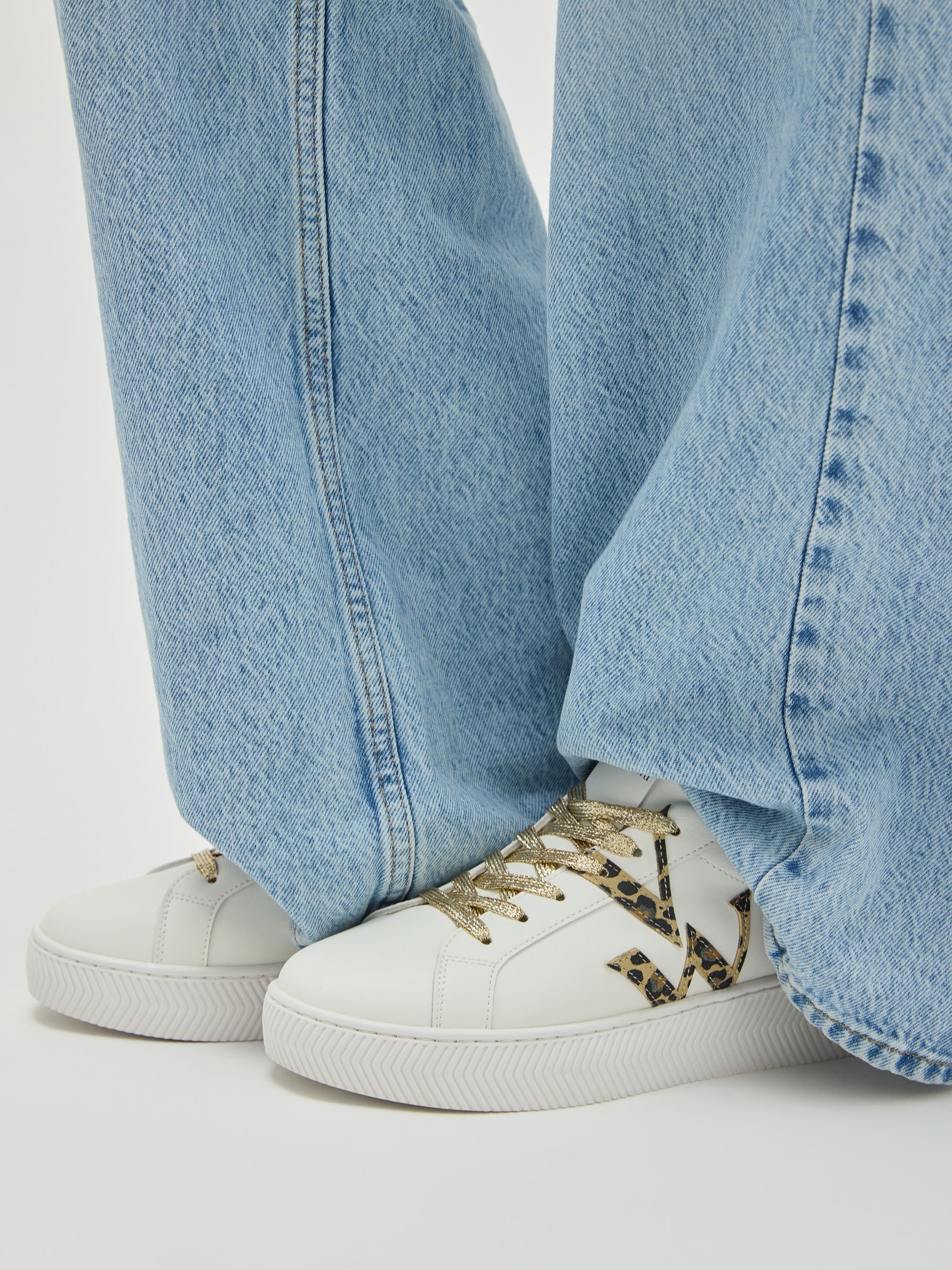 Monogram sneakers with chevron sole. VANESSA WU White