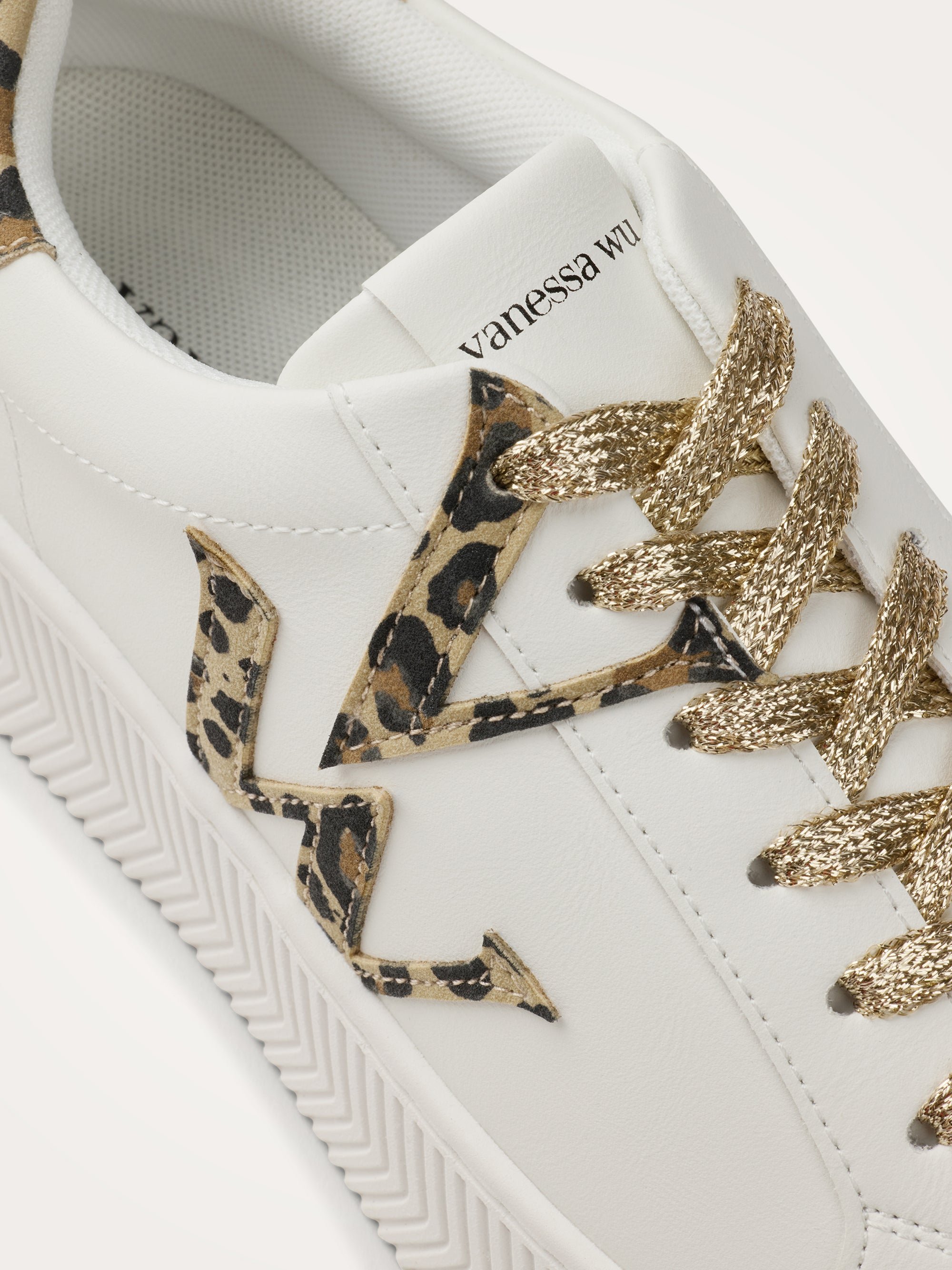 Monogram sneakers with chevron sole. VANESSA WU White