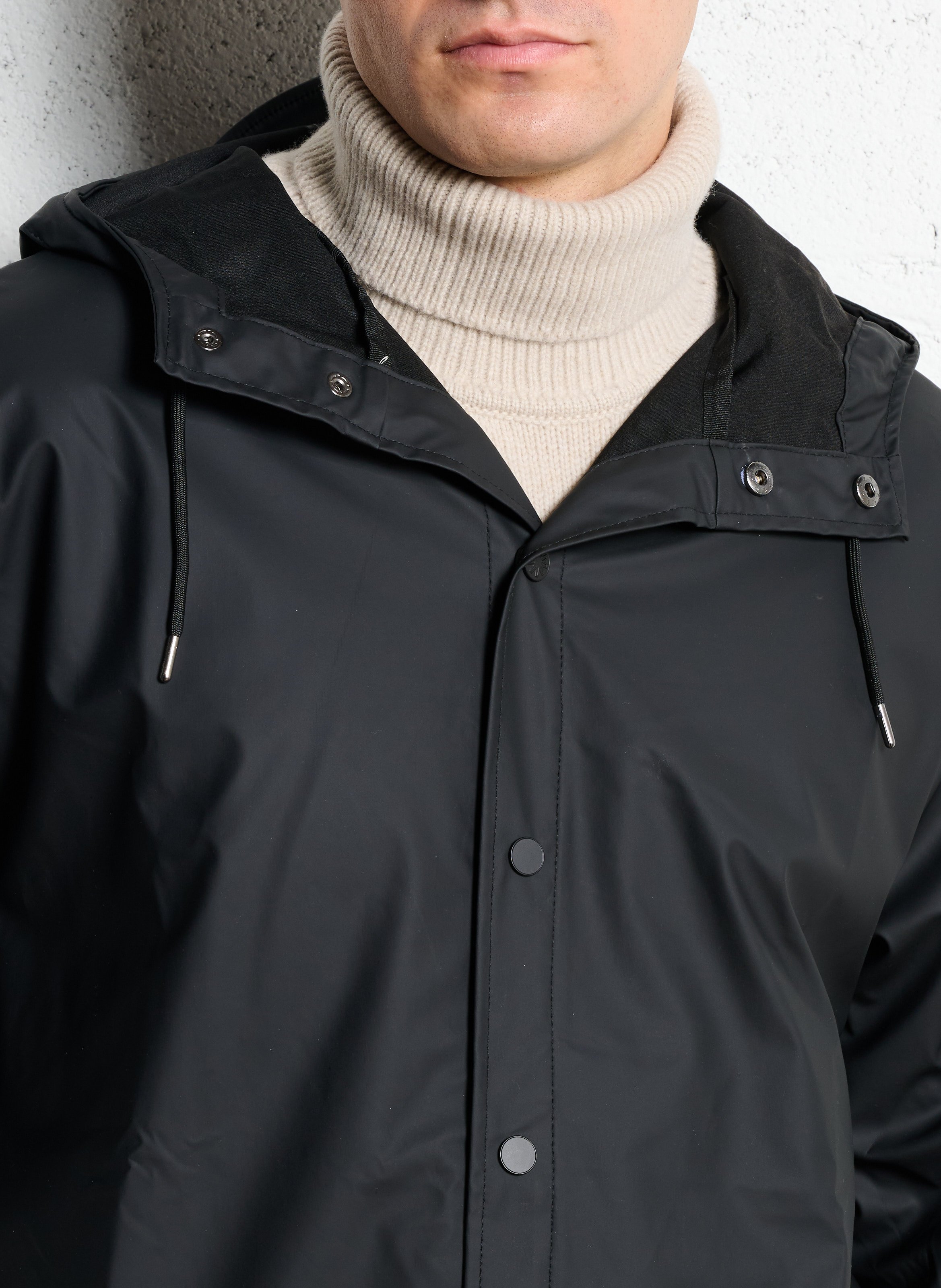 Coupe-vent à capuche RAINS Noir