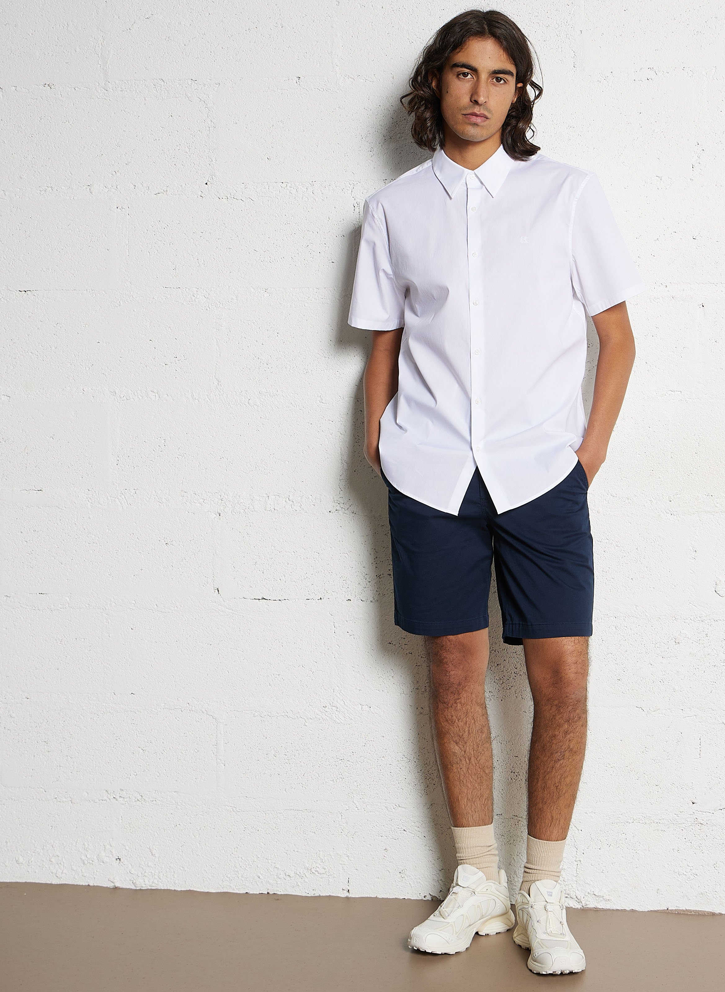 Short solid color chino in blended cotton. CALVIN KLEIN Blue