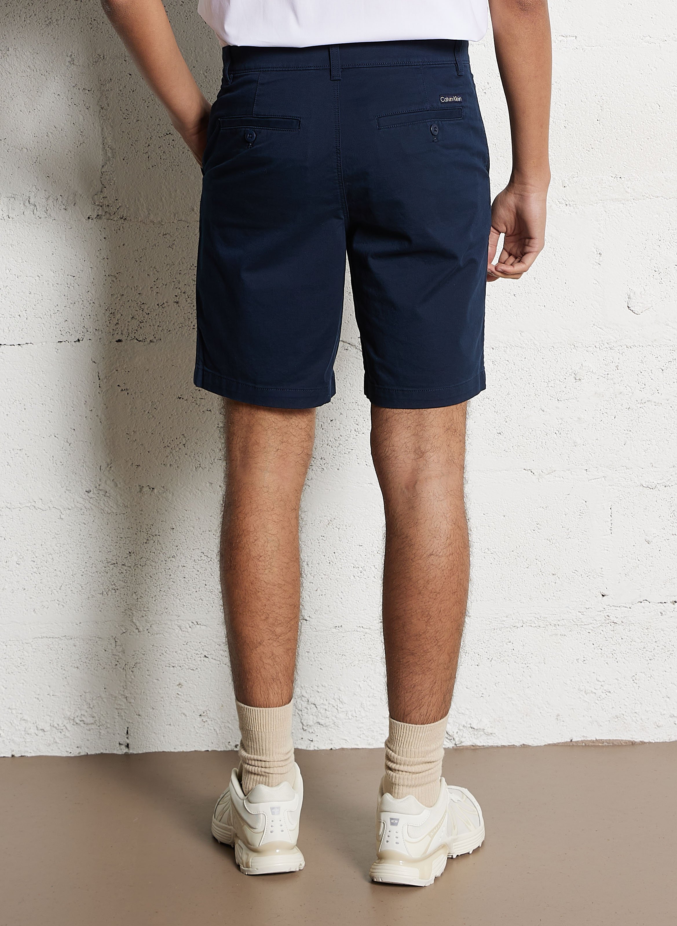 Short solid color chino in blended cotton. CALVIN KLEIN Blue