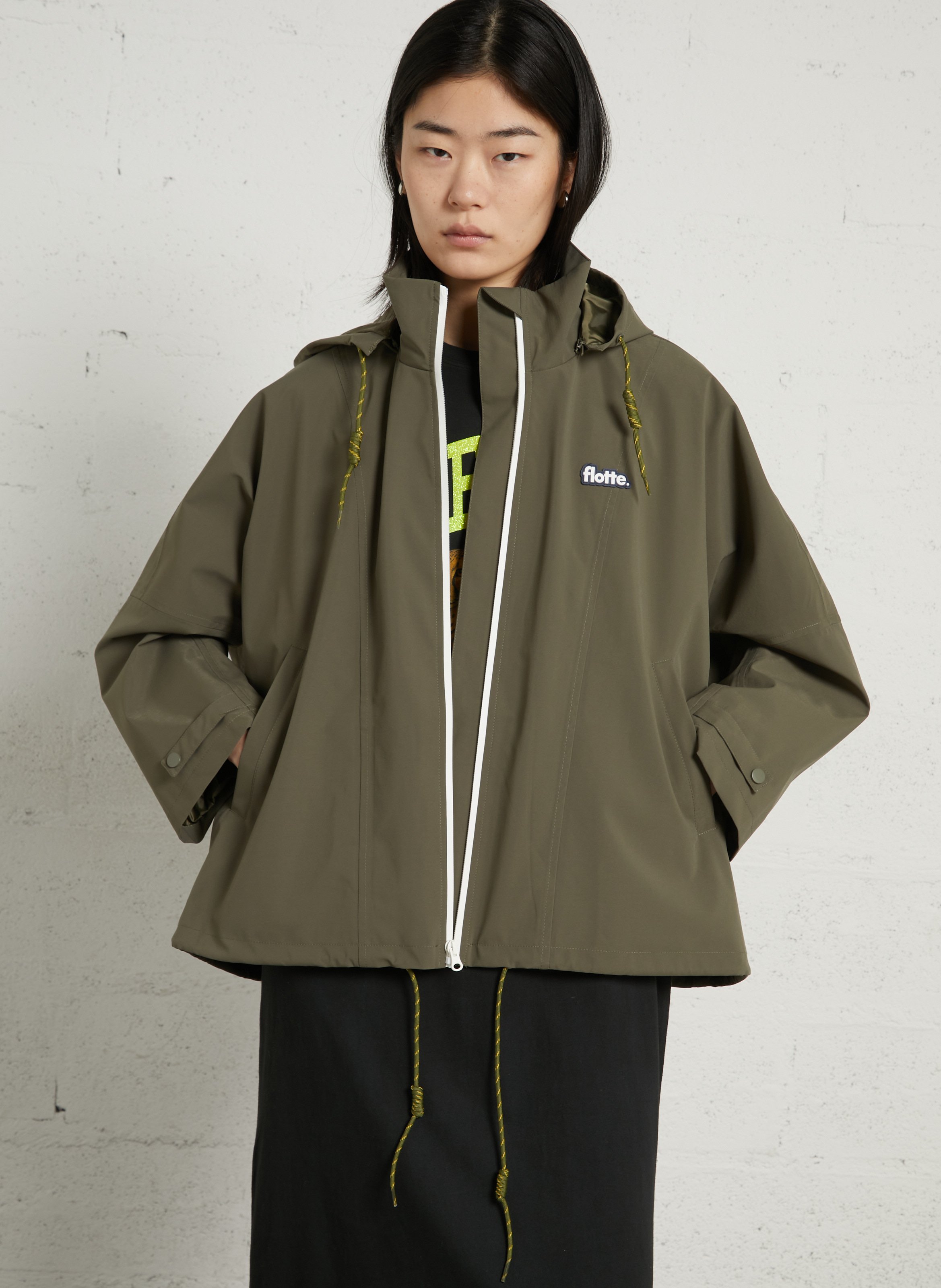 Buttoned and zipped high-neck fitted raincoat FLOTTE Green