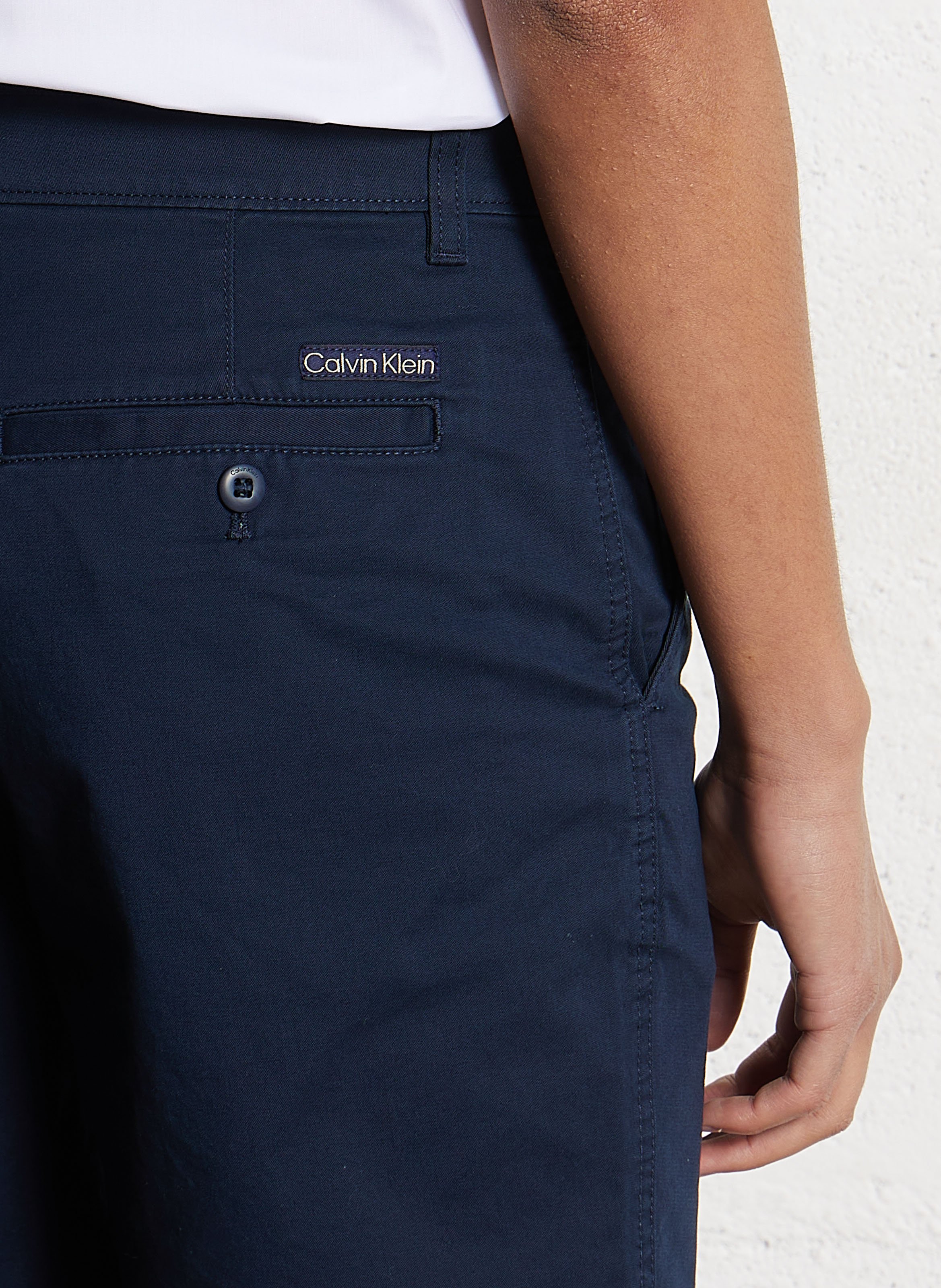 Short solid color chino in blended cotton. CALVIN KLEIN Blue