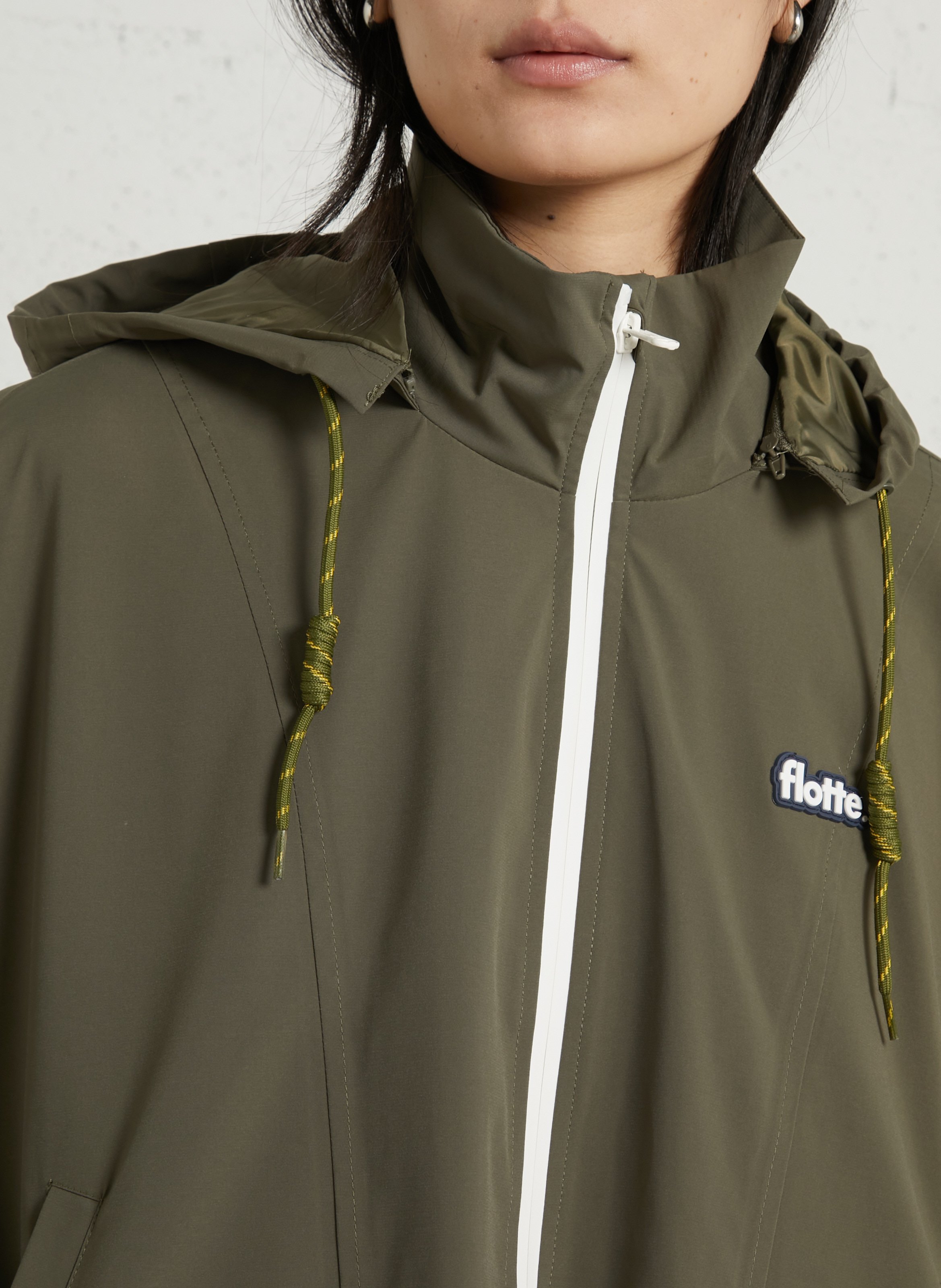Buttoned and zipped high-neck fitted raincoat FLOTTE Green