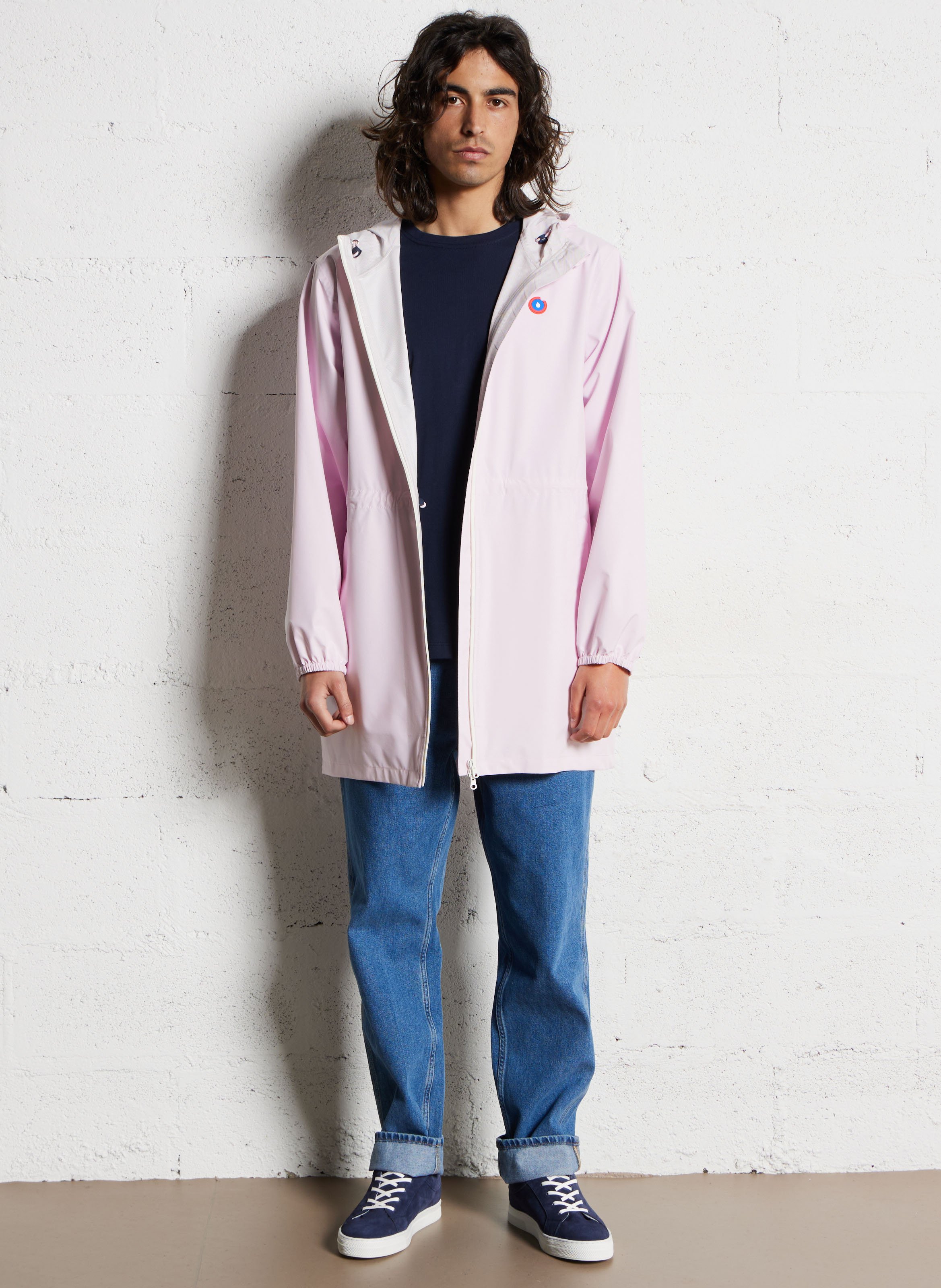 Lange regenjas met capuchon, om te vormen tot rugzakje Roze