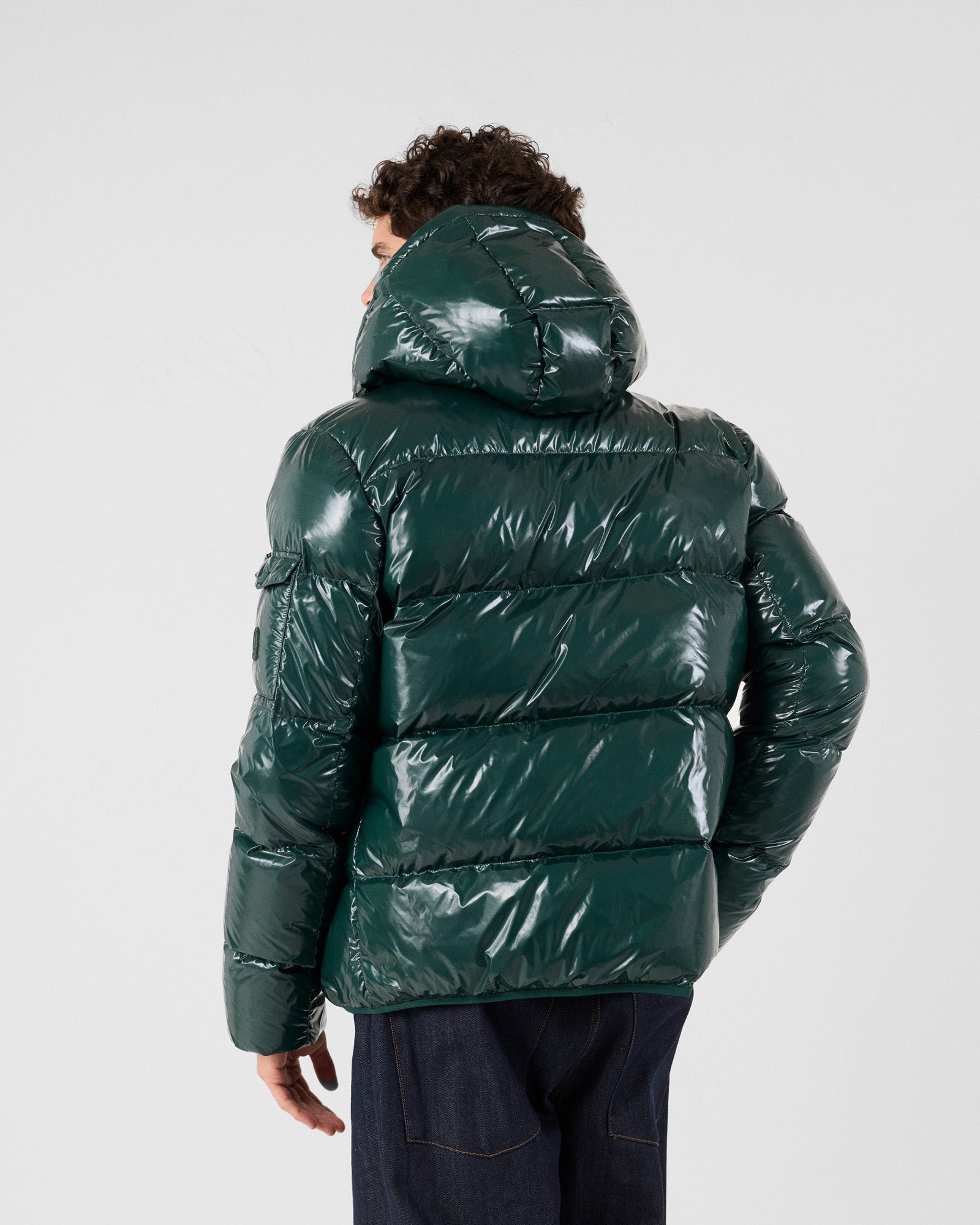 Hooded down jacket for extreme cold in lacquered Java forest. JOTT Green