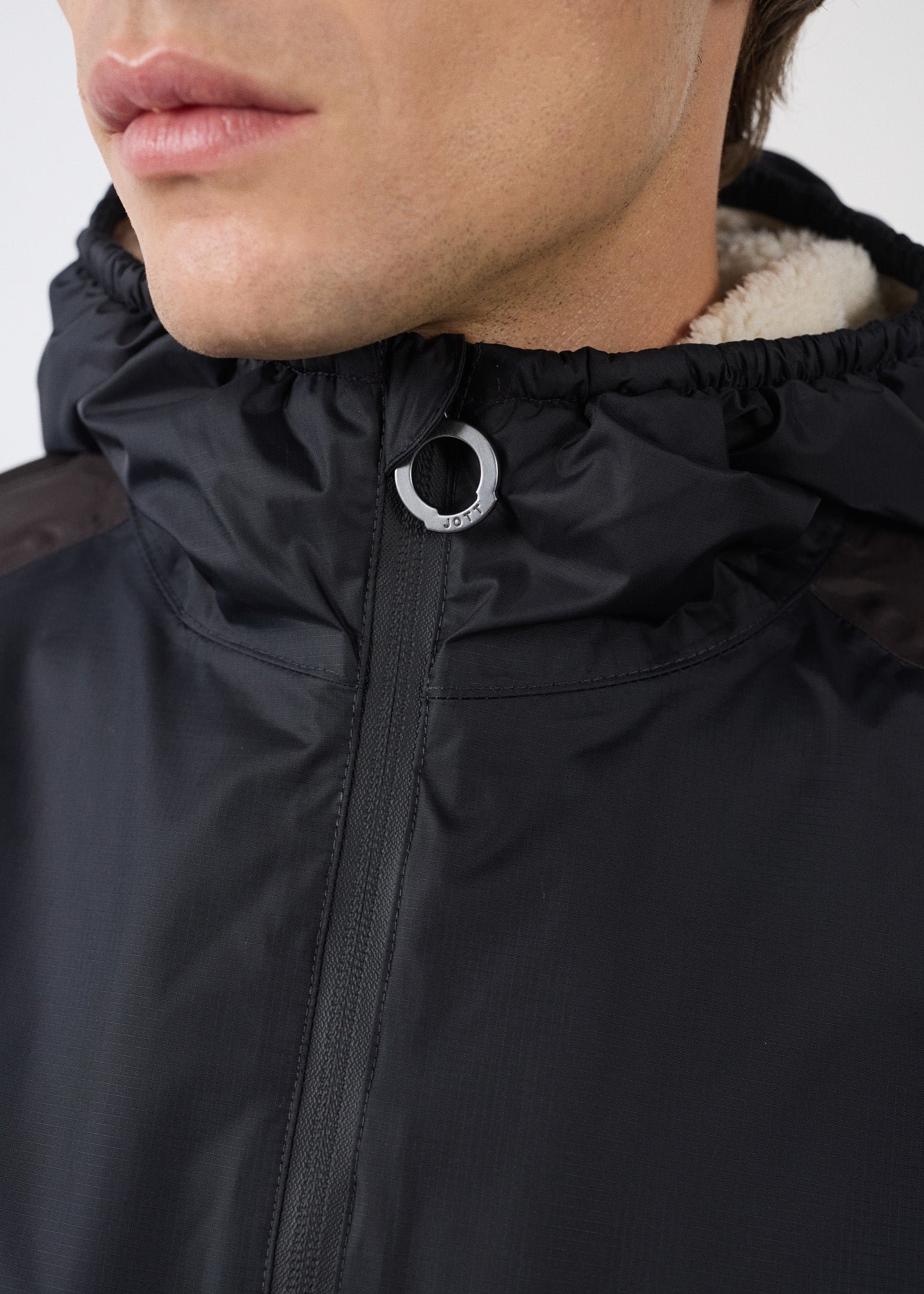 Sherpa-lined waterproof coat. Black