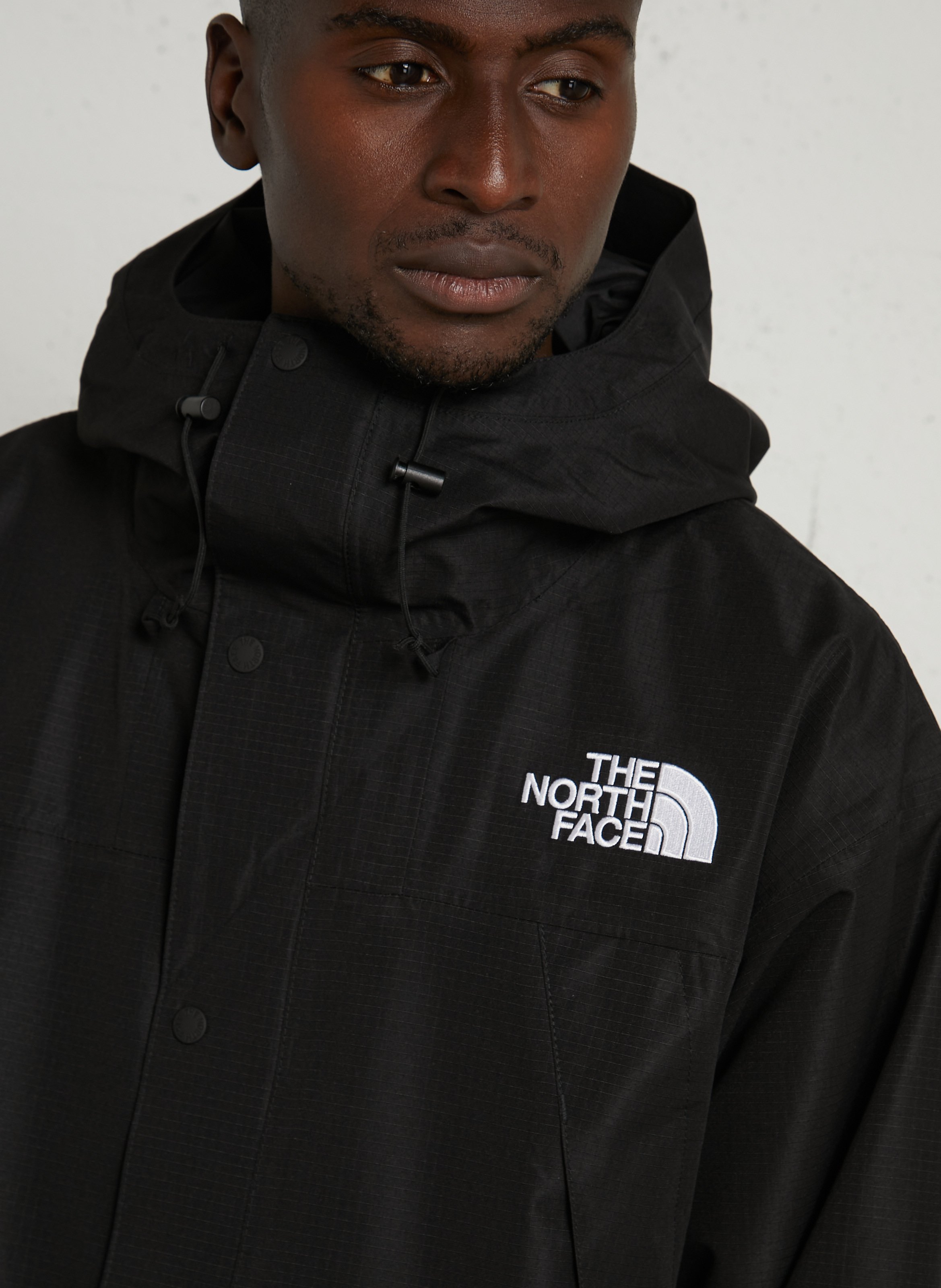 Windjacke mit Kapuze THE NORTH FACE Schwarz