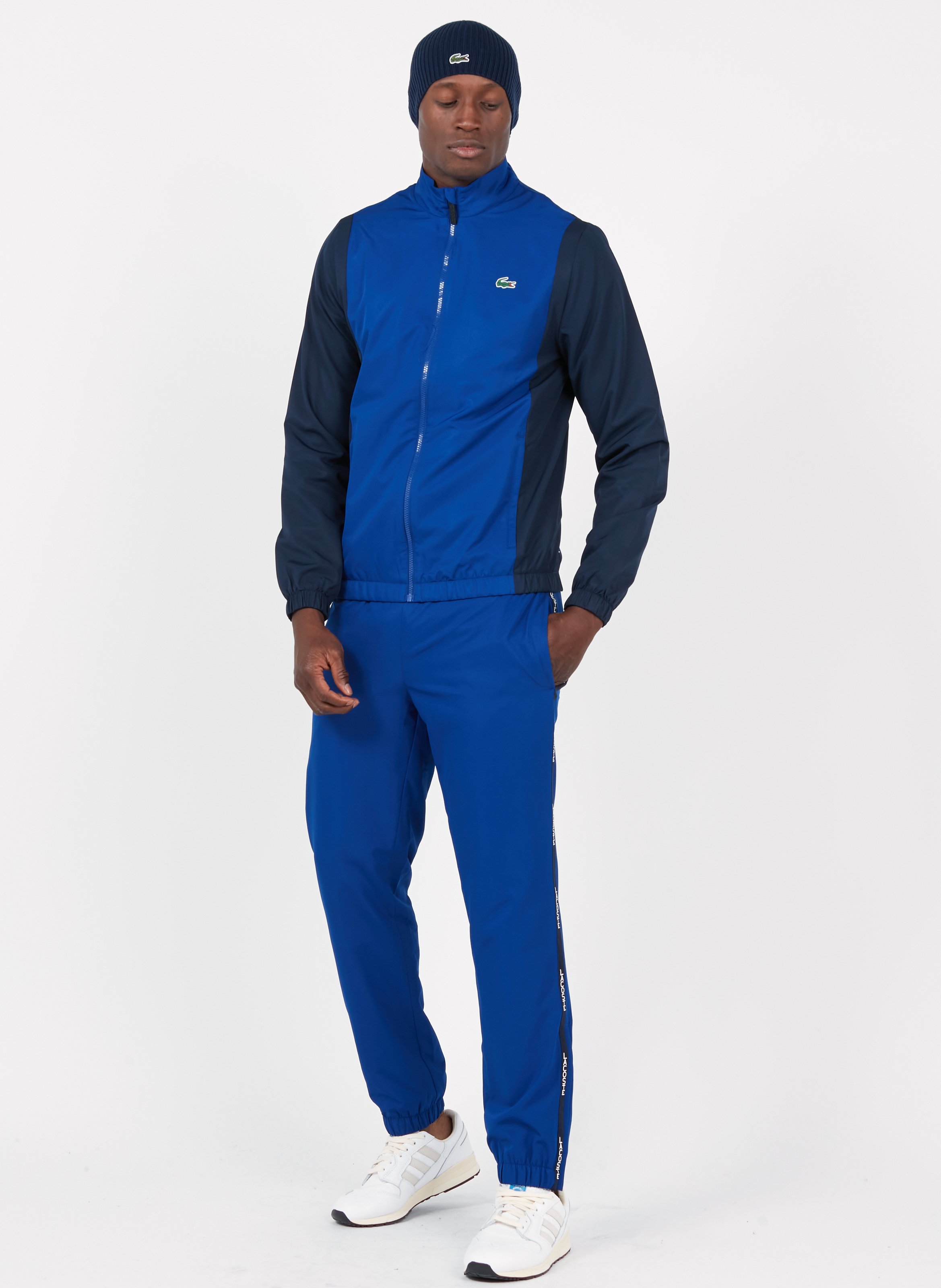 Trainingspak Cosmique/marine-marine-blanc Lacoste - Heren | Place des  Tendances